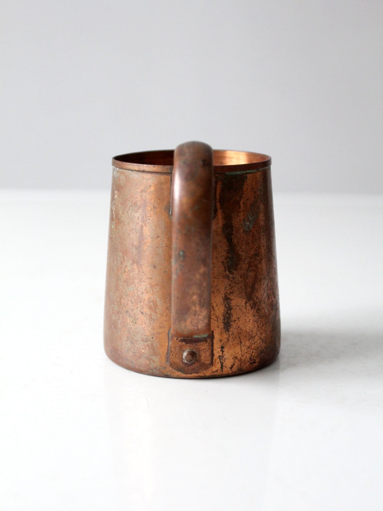 vintage copper mug with riveted handle