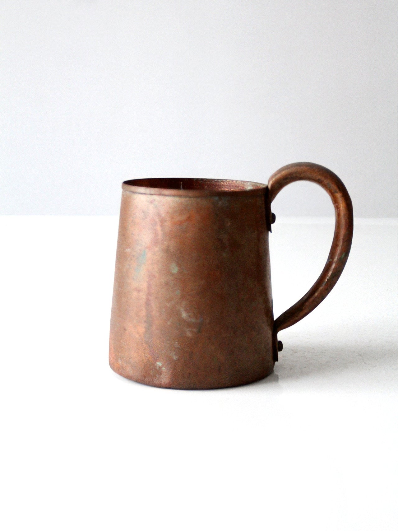 vintage copper mug with riveted handle
