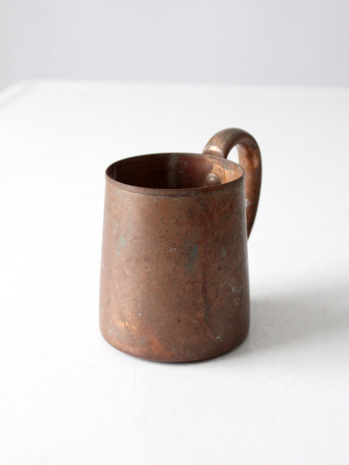vintage copper mug with riveted handle