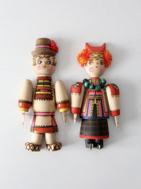 mid-century Scandinavian folk art wall hangings pair