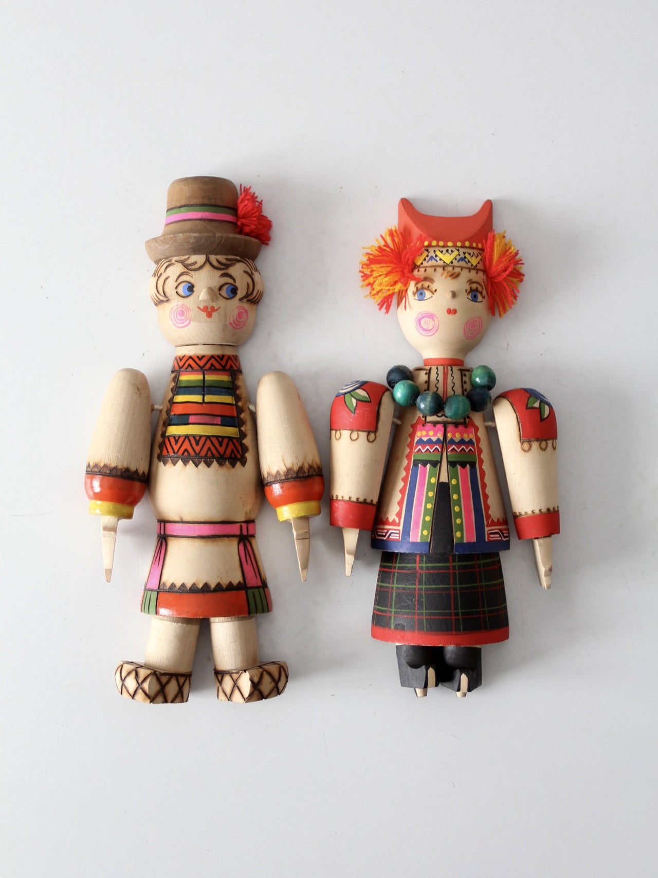 mid-century Scandinavian folk art wall hangings pair