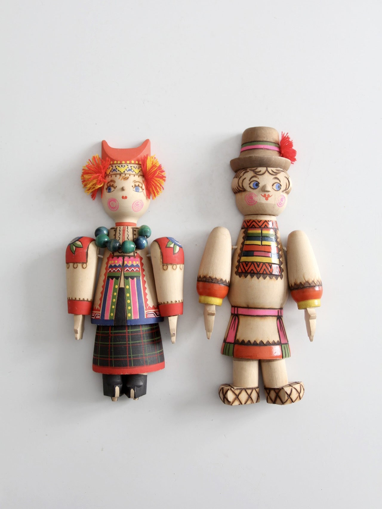 mid-century Scandinavian folk art wall hangings pair