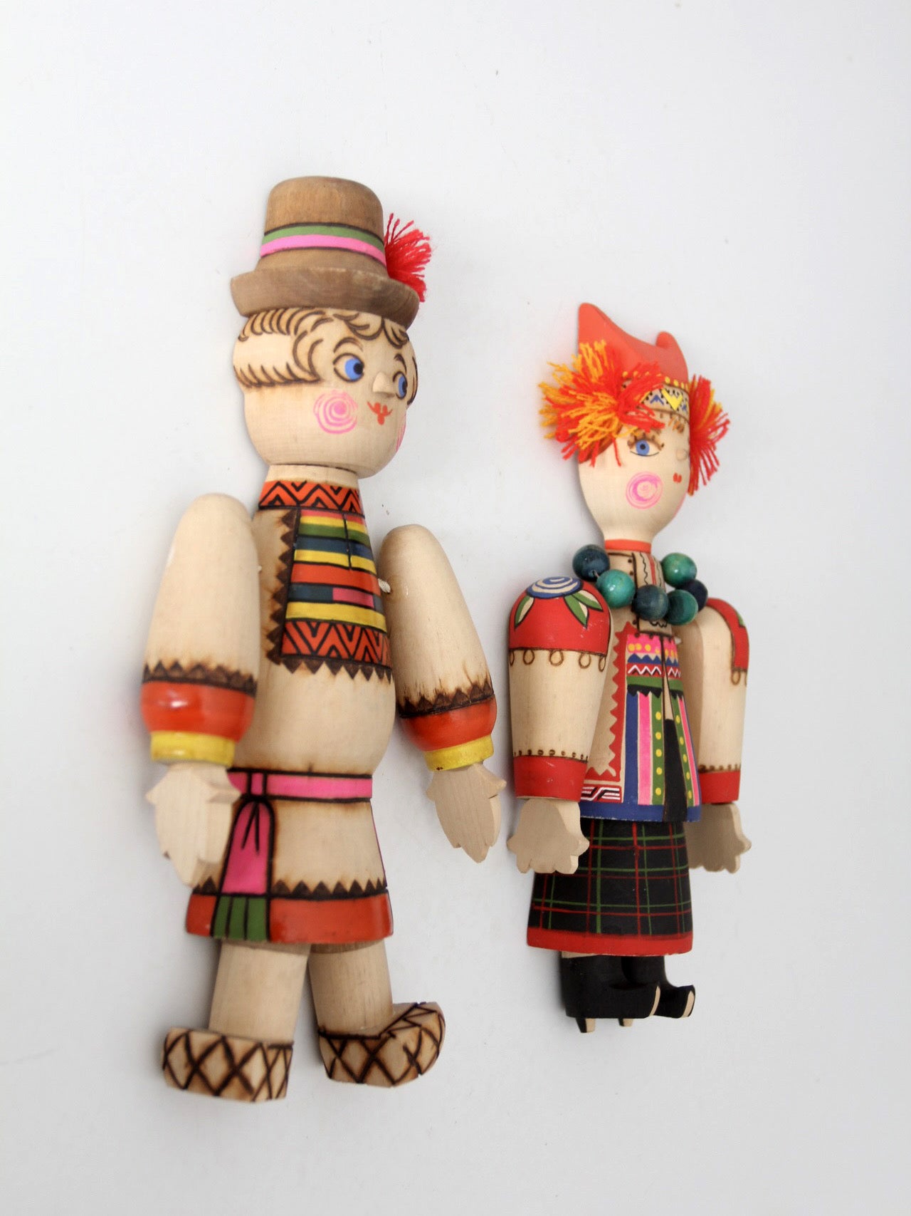 mid-century Scandinavian folk art wall hangings pair
