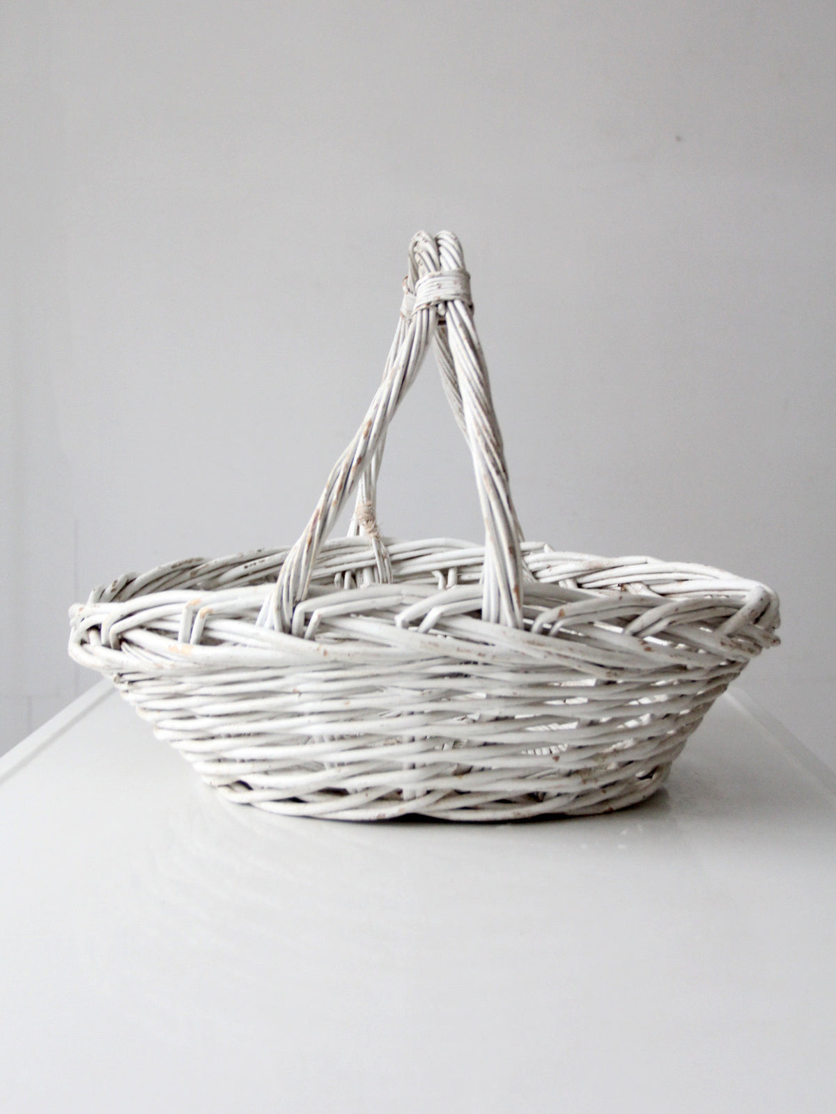 vintage white wicker gathering basket