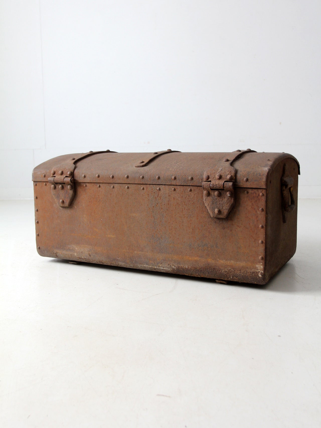 antique riveted iron trunk