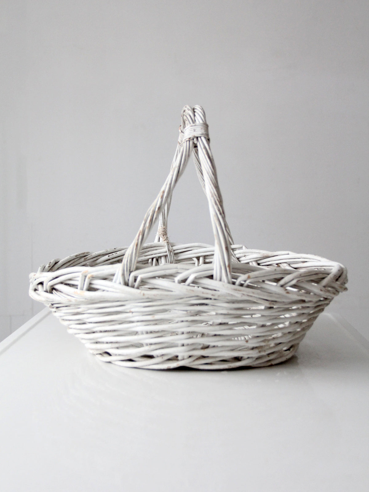 vintage white wicker gathering basket