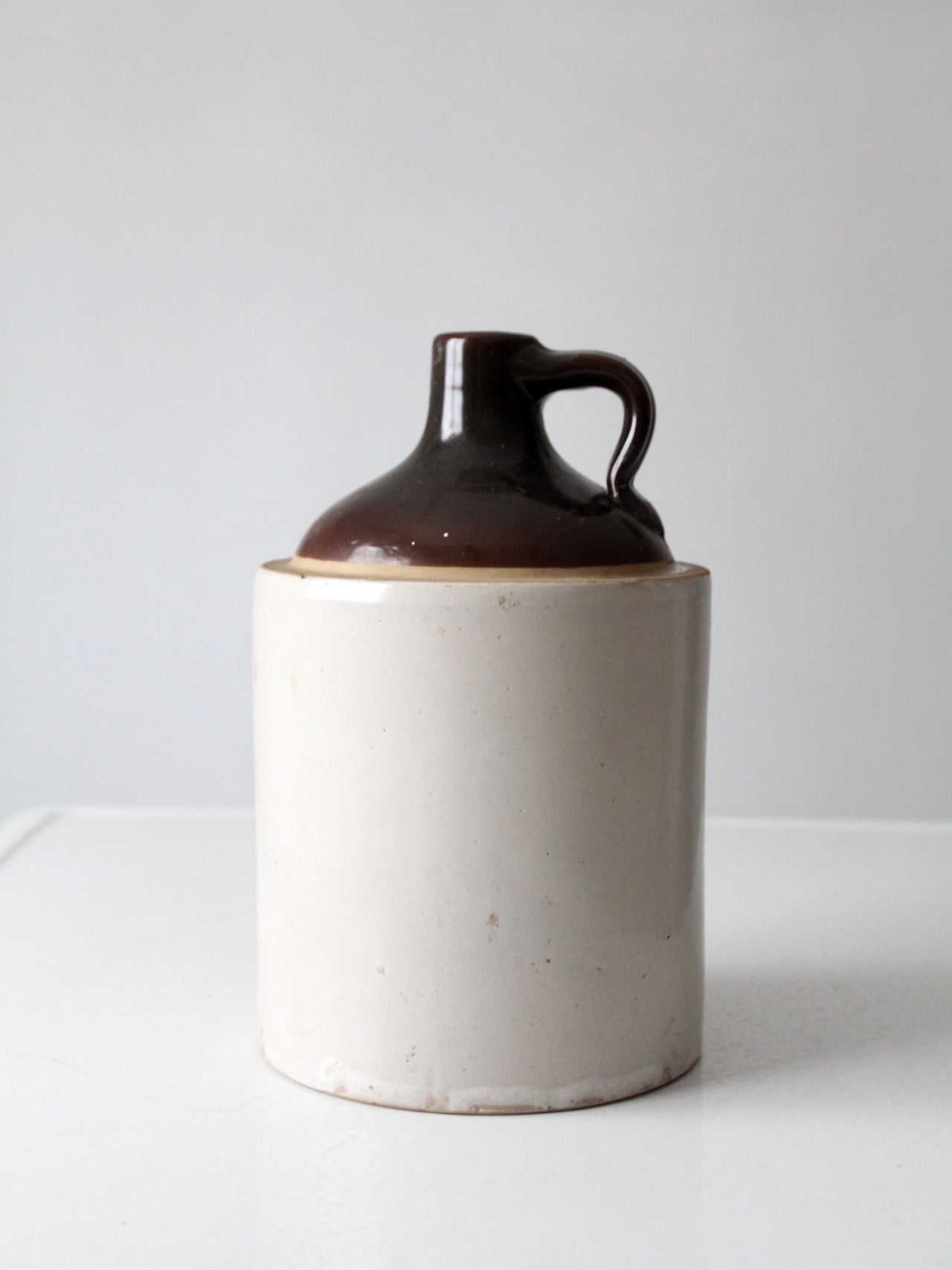 antique stoneware jug with brown glaze