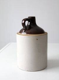 antique stoneware jug with brown glaze