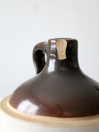 antique stoneware jug with brown glaze