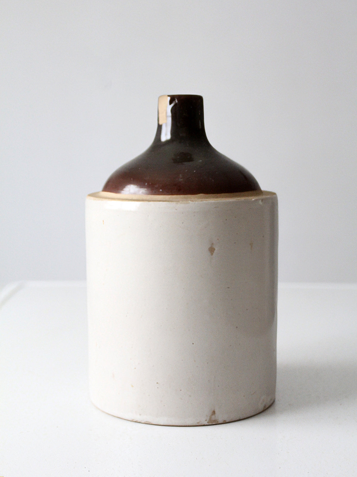 antique stoneware jug with brown glaze
