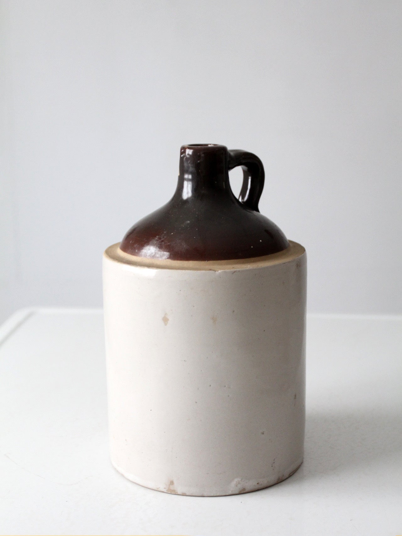 antique stoneware jug with brown glaze