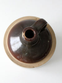 antique stoneware jug with brown glaze