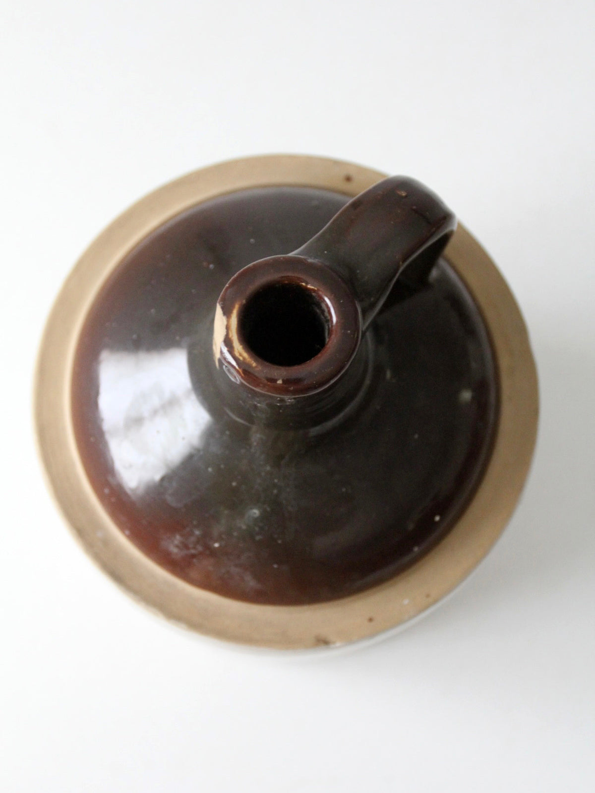 antique stoneware jug with brown glaze
