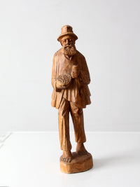 mid-century folk art carved wood peddler figure