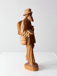 mid-century folk art carved wood peddler figure