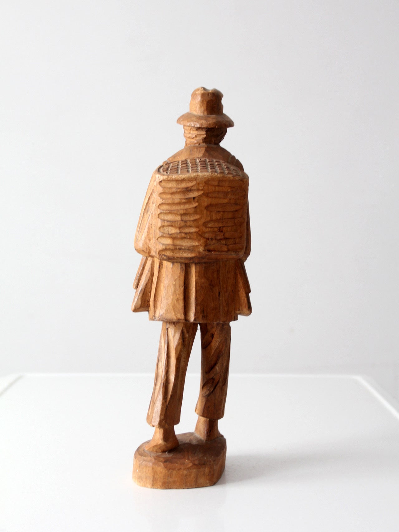 mid-century folk art carved wood peddler figure