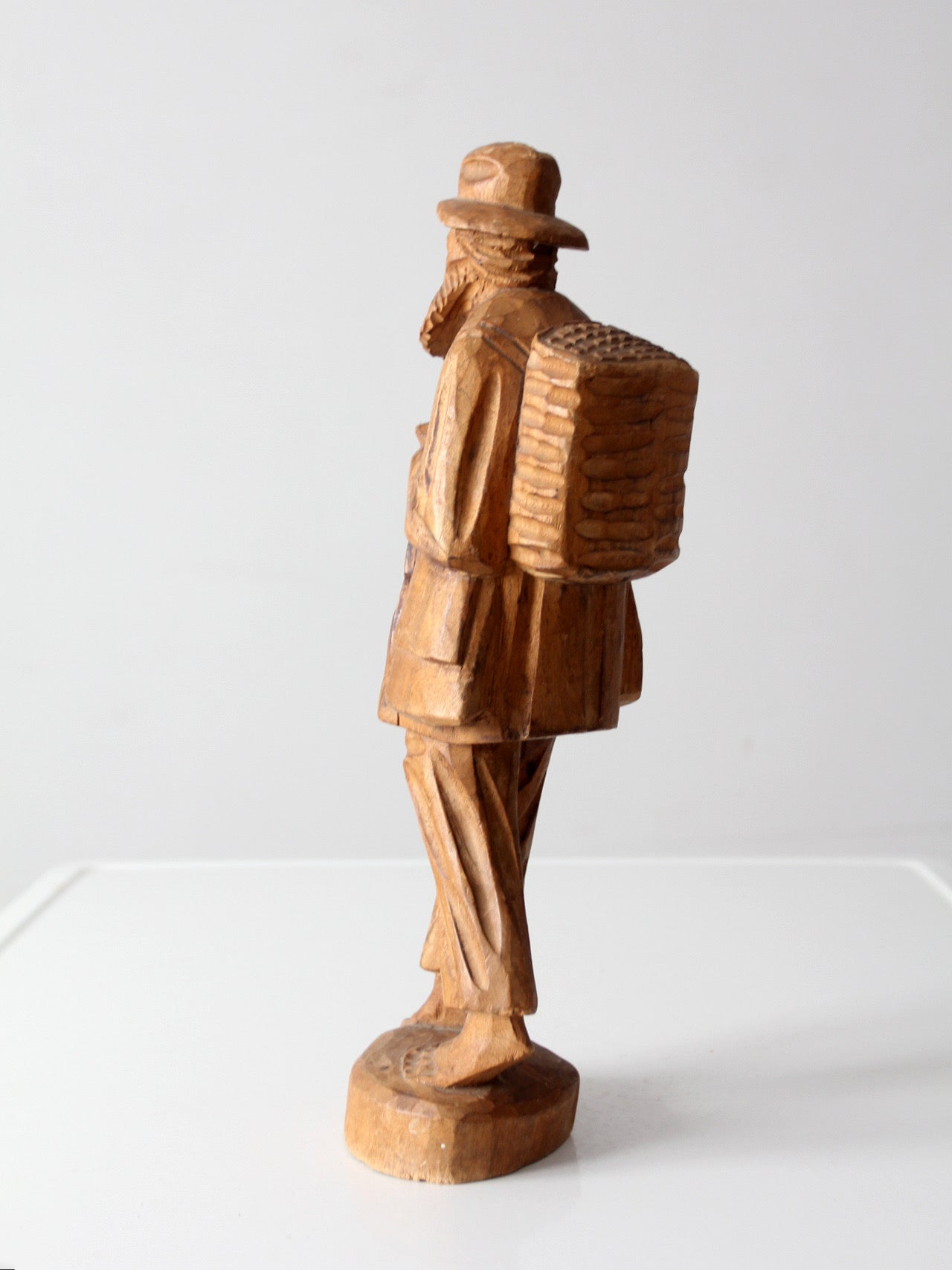 mid-century folk art carved wood peddler figure