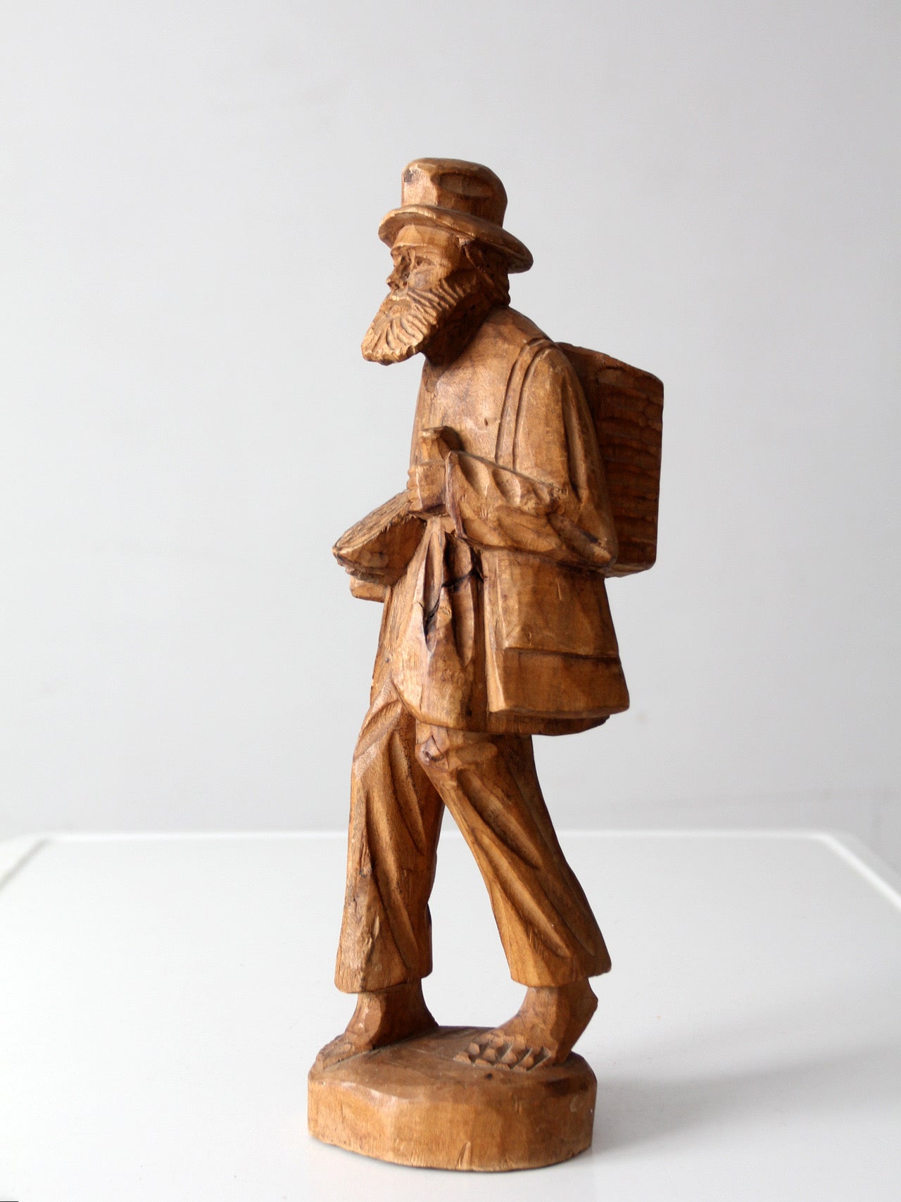 mid-century folk art carved wood peddler figure