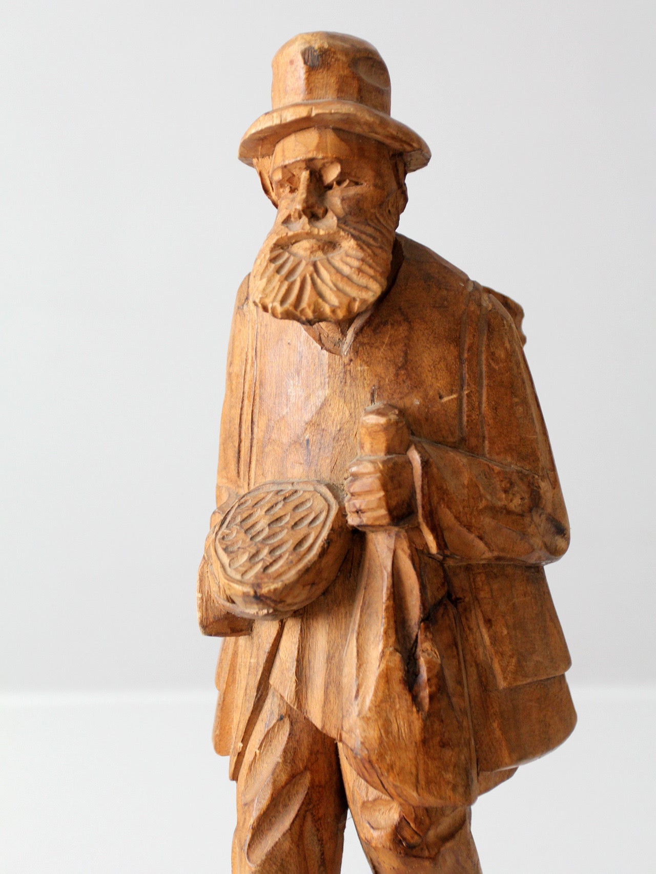 mid-century folk art carved wood peddler figure