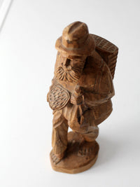mid-century folk art carved wood peddler figure