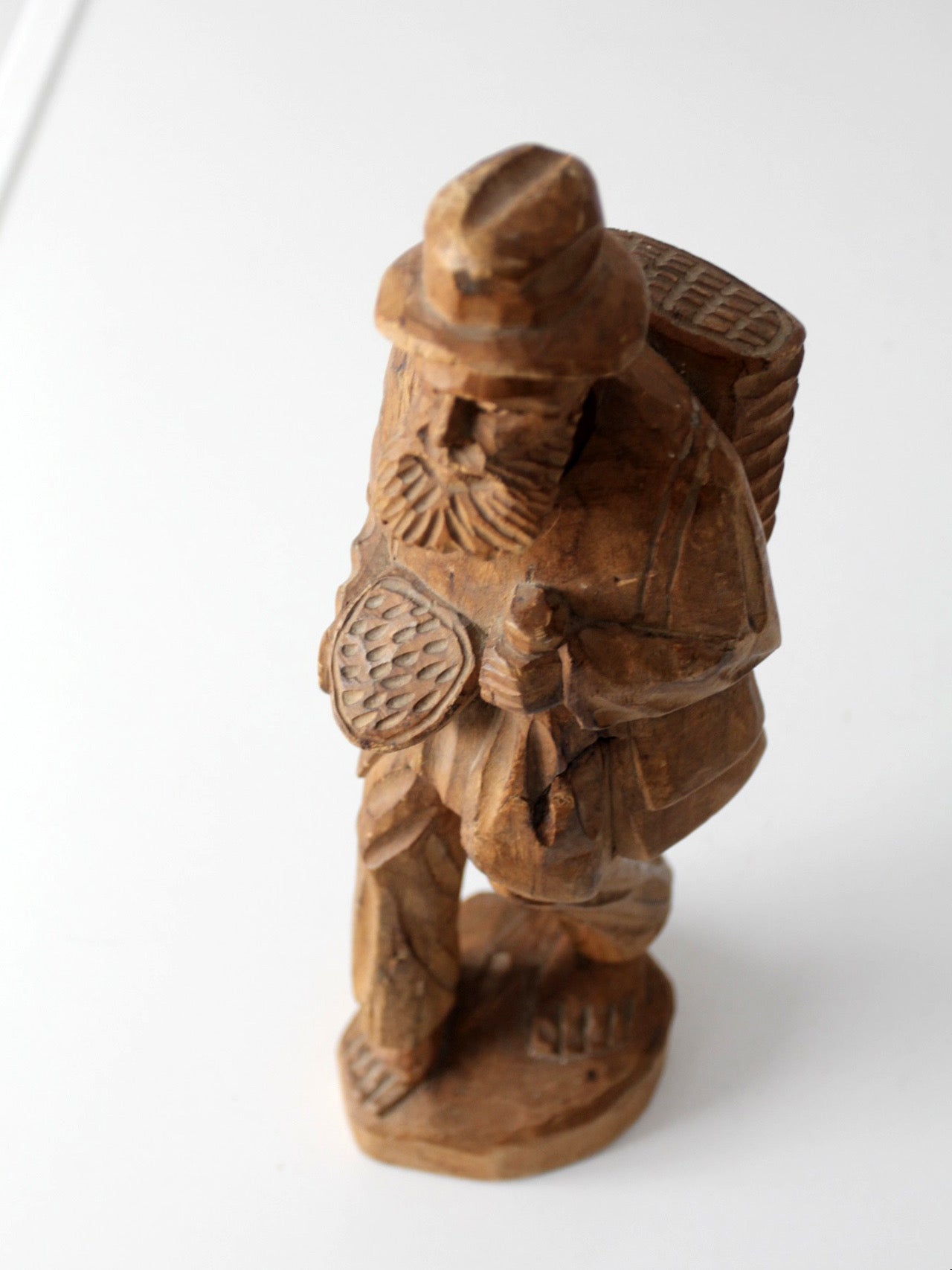 mid-century folk art carved wood peddler figure
