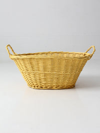 vintage yellow wicker laundry basket