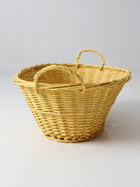 vintage yellow wicker laundry basket