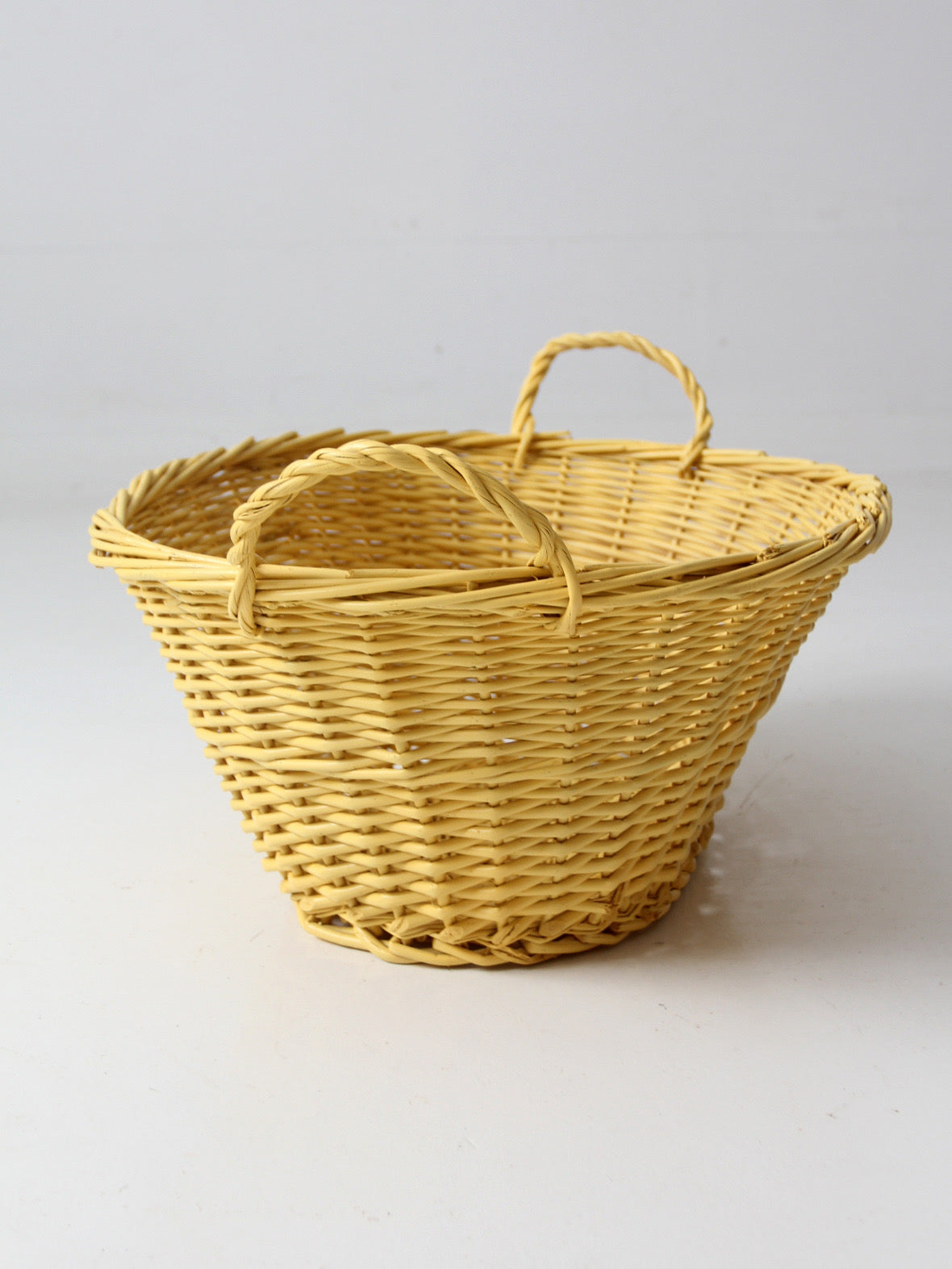vintage yellow wicker laundry basket