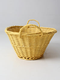 vintage yellow wicker laundry basket