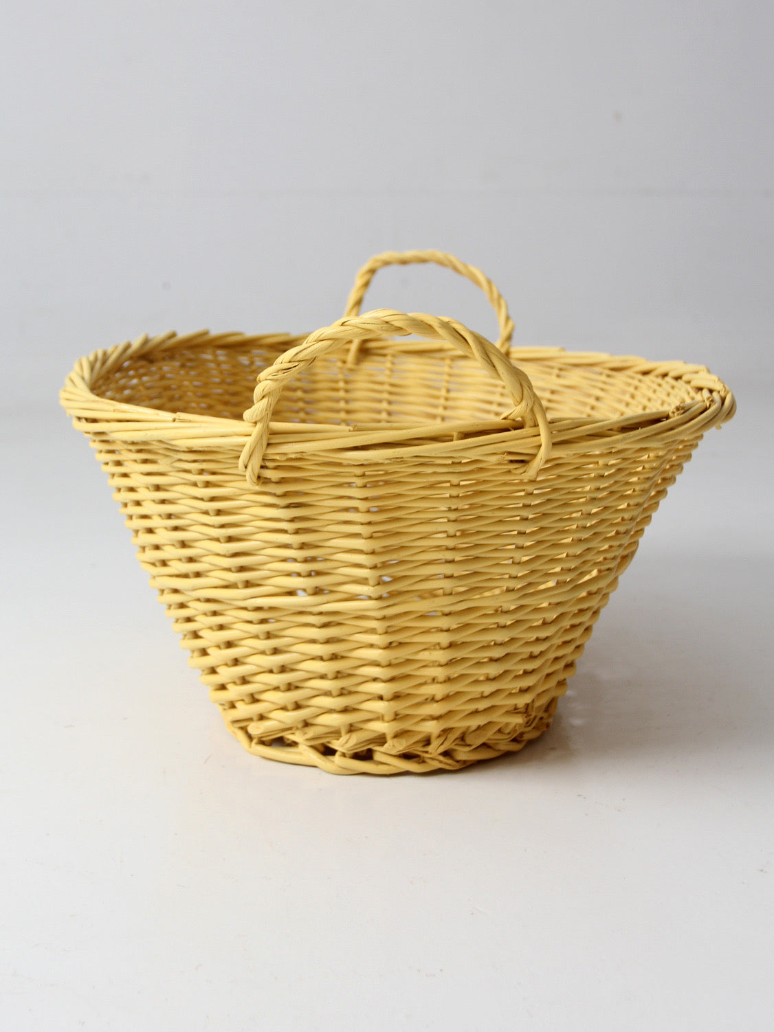 vintage yellow wicker laundry basket