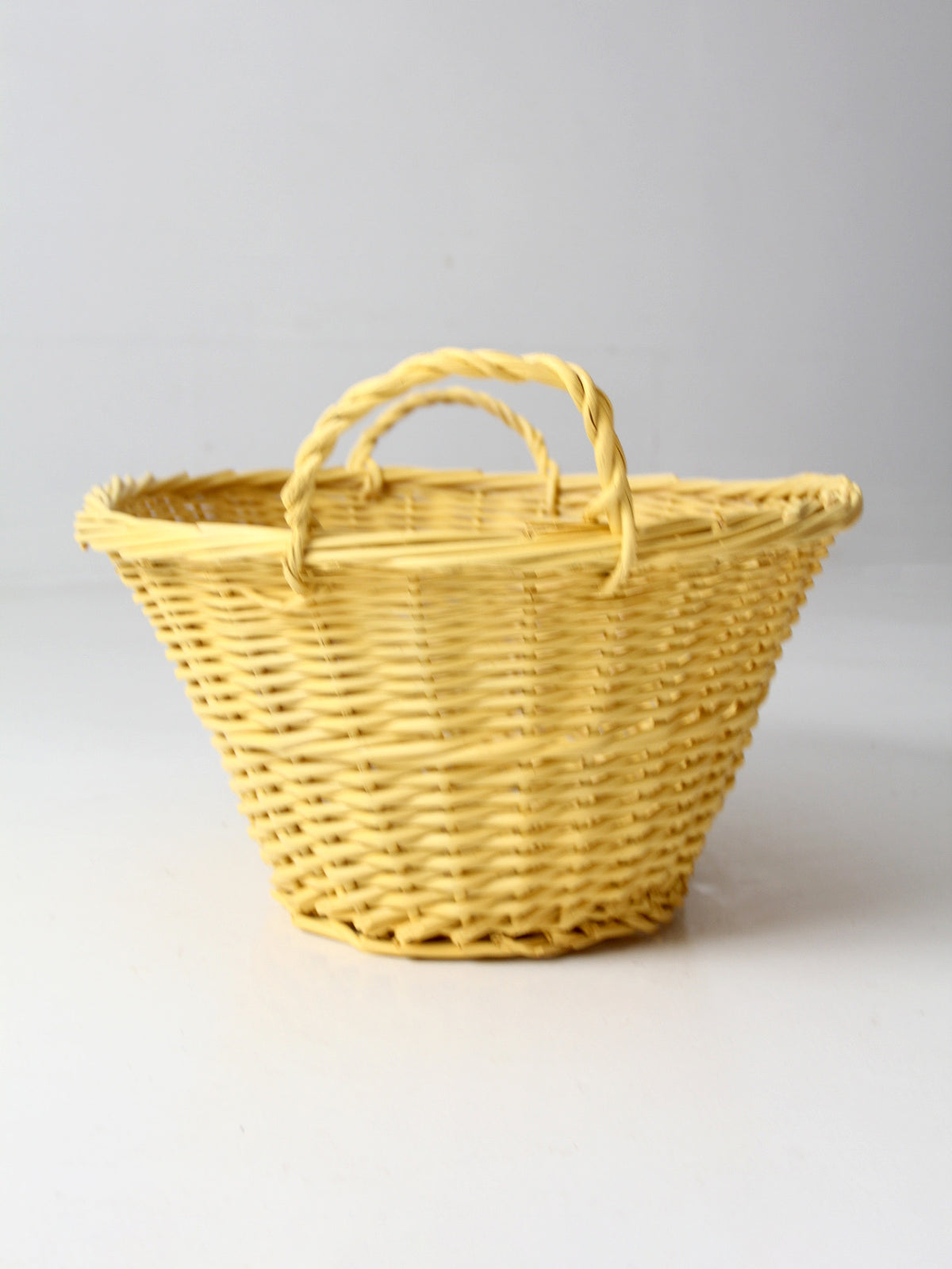 vintage yellow wicker laundry basket