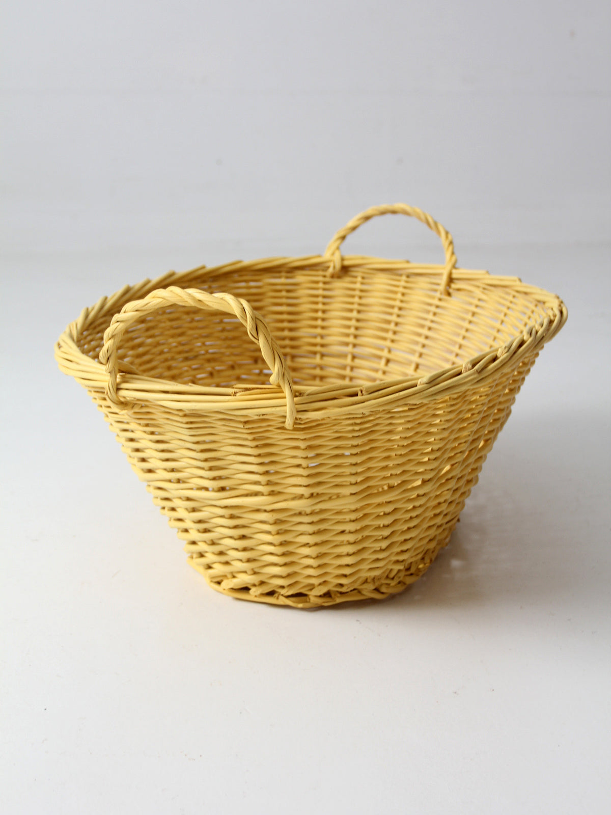 vintage yellow wicker laundry basket