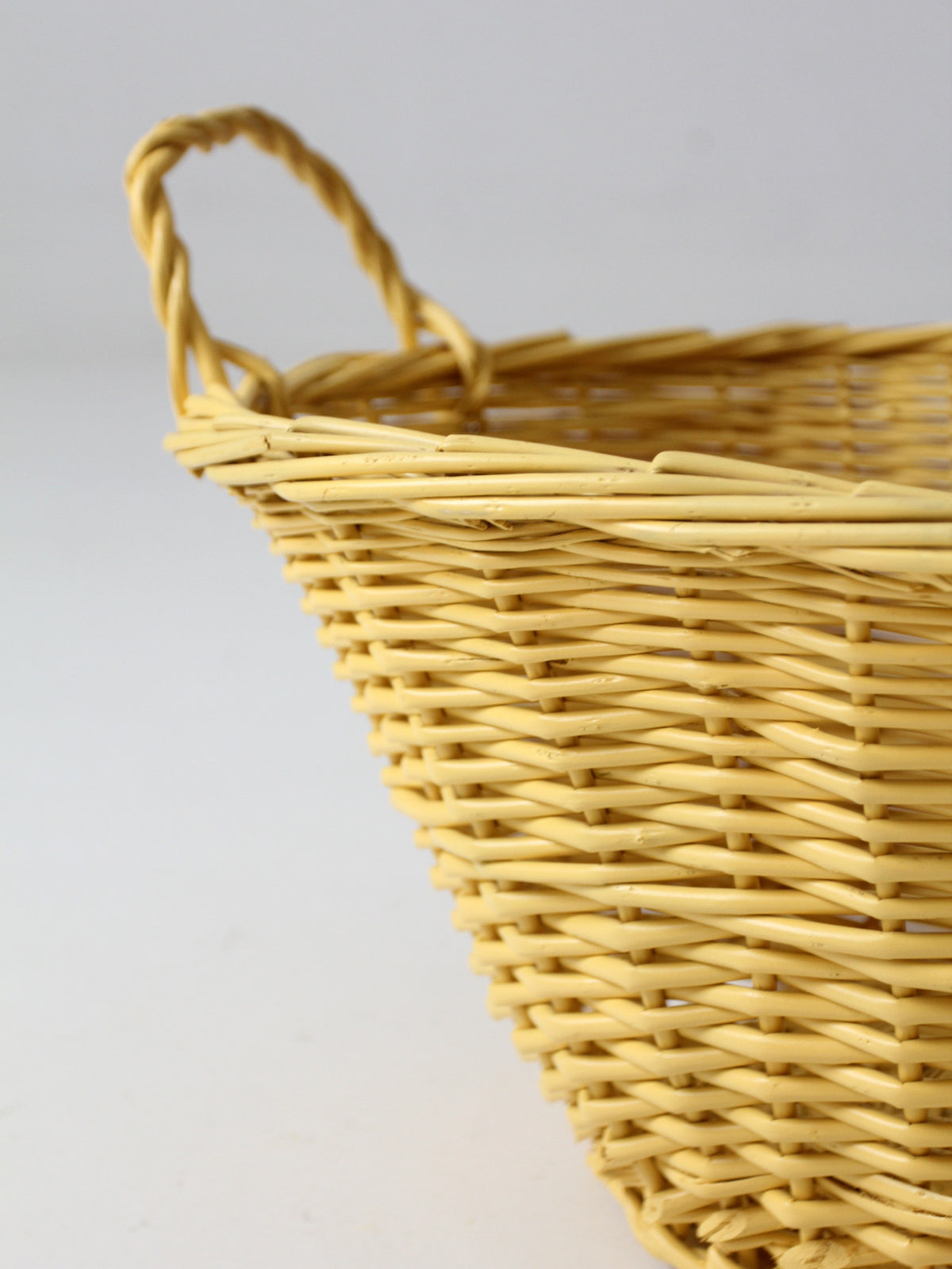 vintage yellow wicker laundry basket