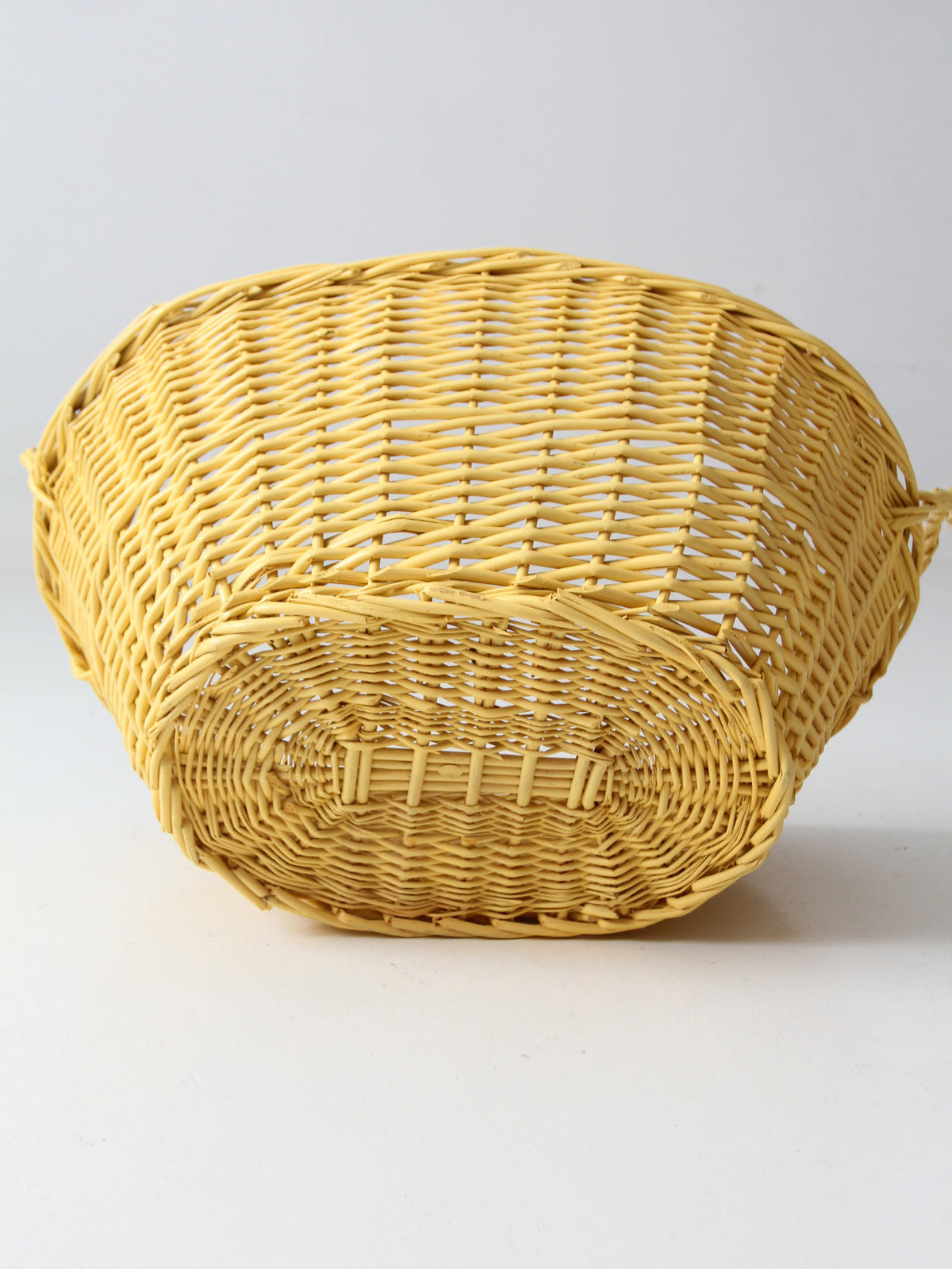 vintage yellow wicker laundry basket