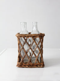 vintage wicker bottle basket with glass bottles