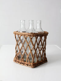 vintage wicker bottle basket with glass bottles