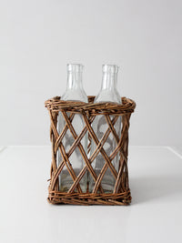 vintage wicker bottle basket with glass bottles