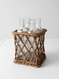vintage wicker bottle basket with glass bottles