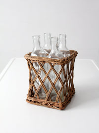 vintage wicker bottle basket with glass bottles
