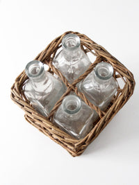 vintage wicker bottle basket with glass bottles