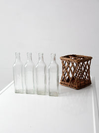vintage wicker bottle basket with glass bottles