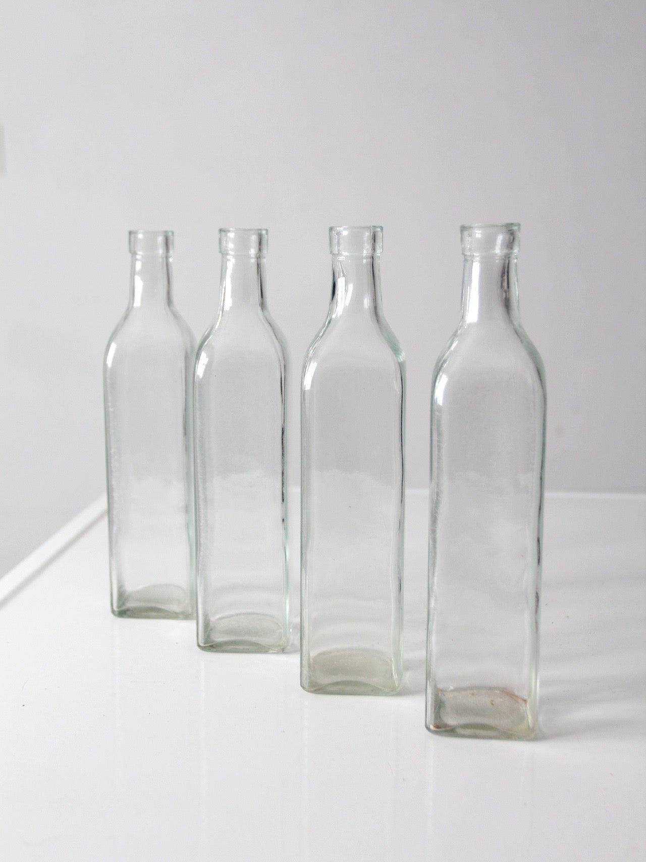 vintage wicker bottle basket with glass bottles