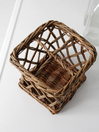 vintage wicker bottle basket with glass bottles