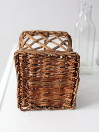 vintage wicker bottle basket with glass bottles