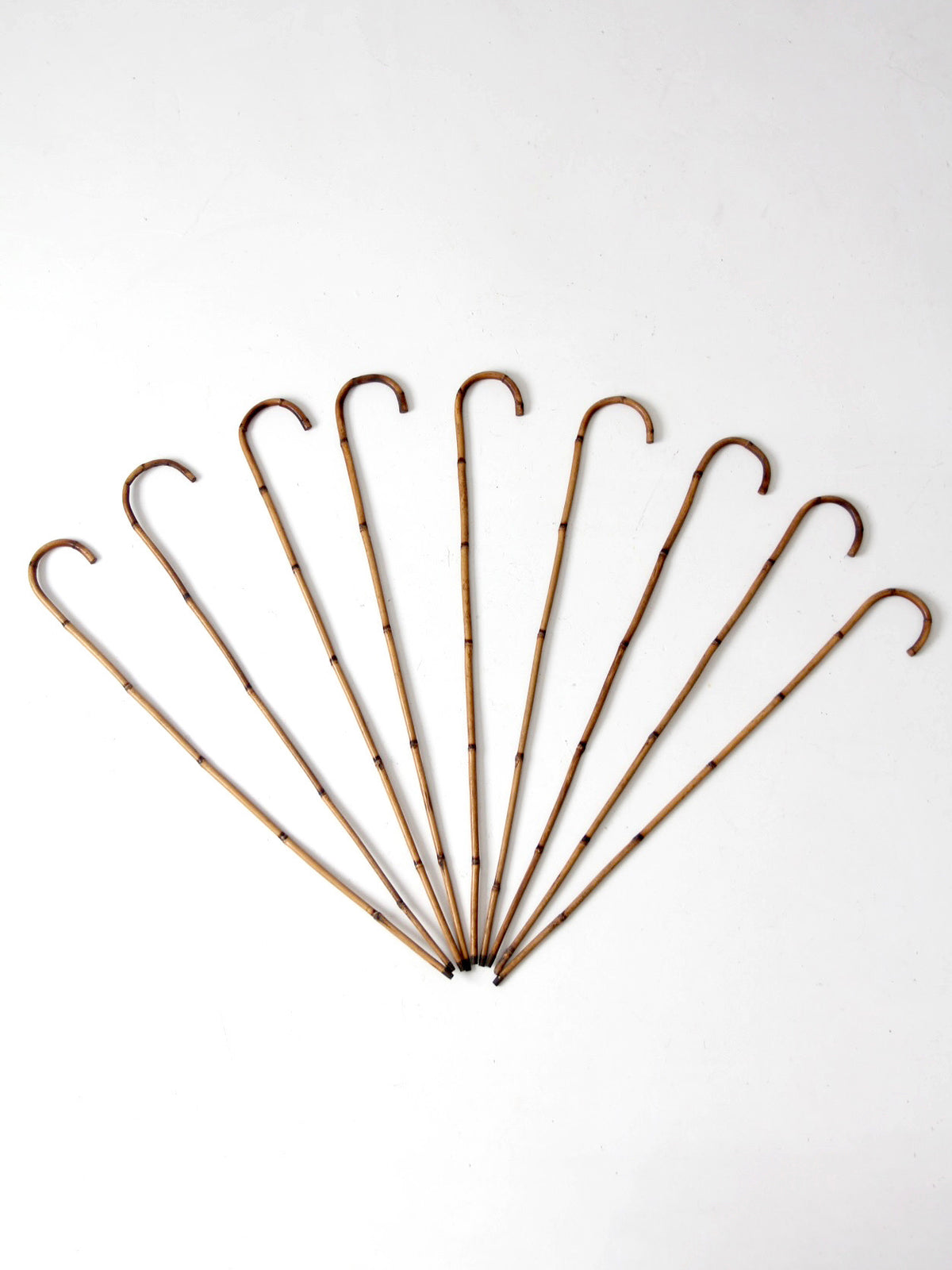 collection of antique bamboo walking canes