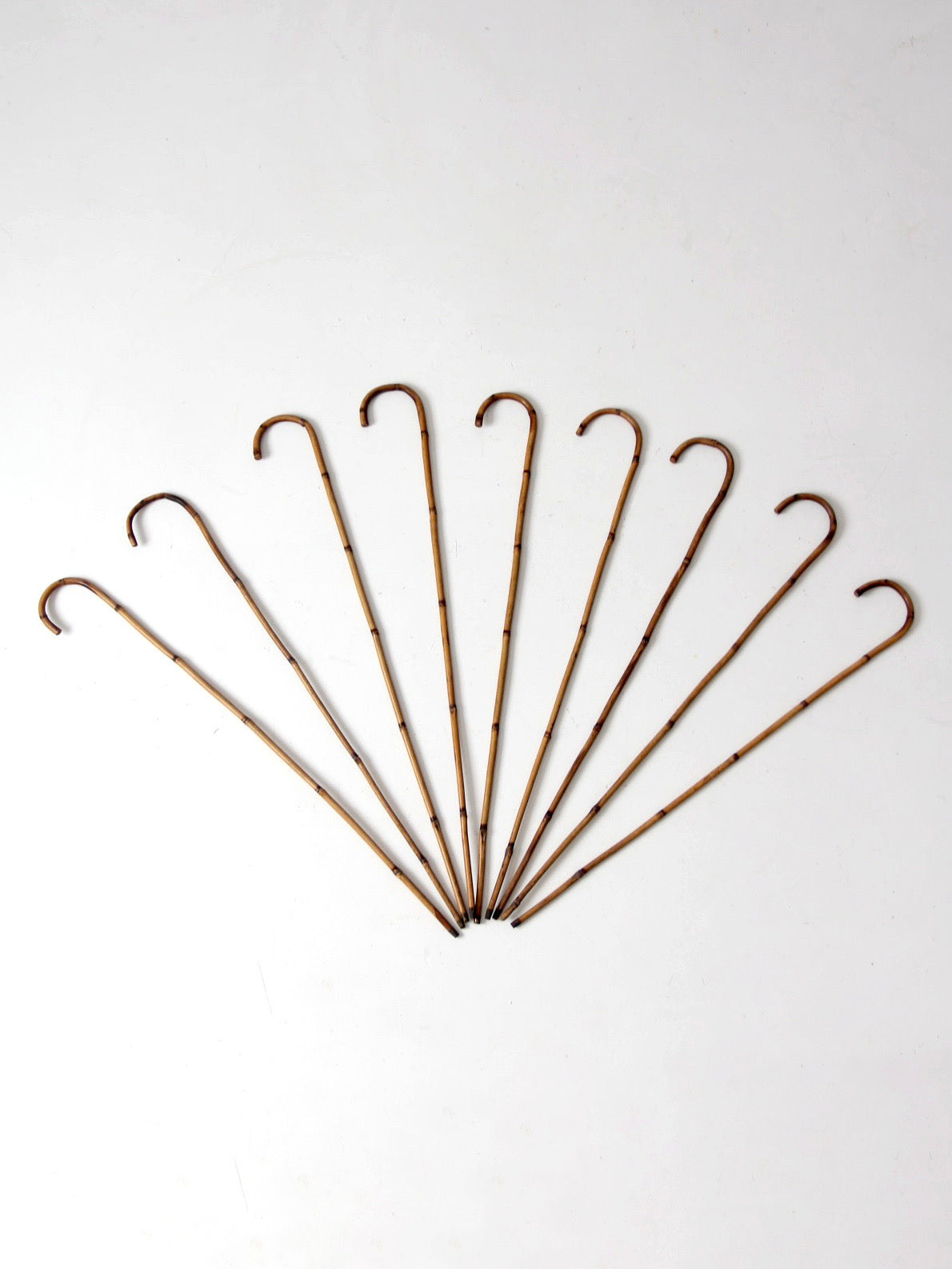 collection of antique bamboo walking canes