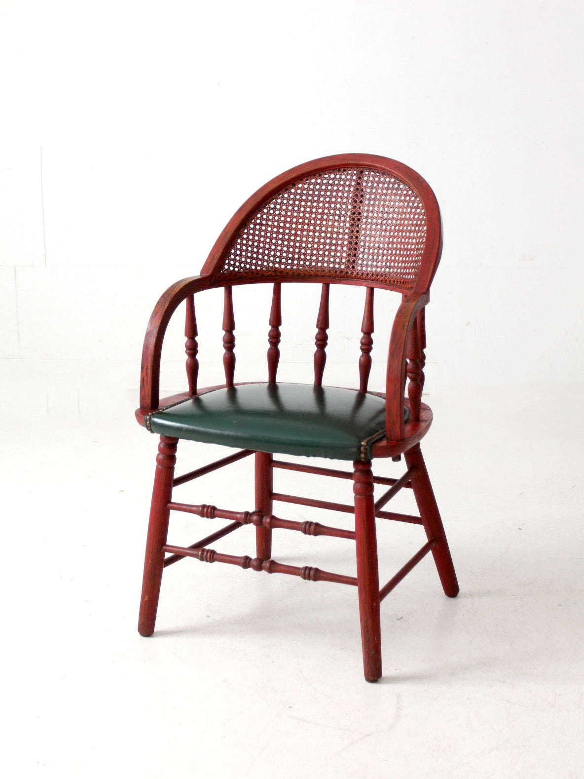 antique red Windsor cane back arm chair with upholstered seat