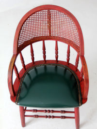 antique red Windsor cane back arm chair with upholstered seat