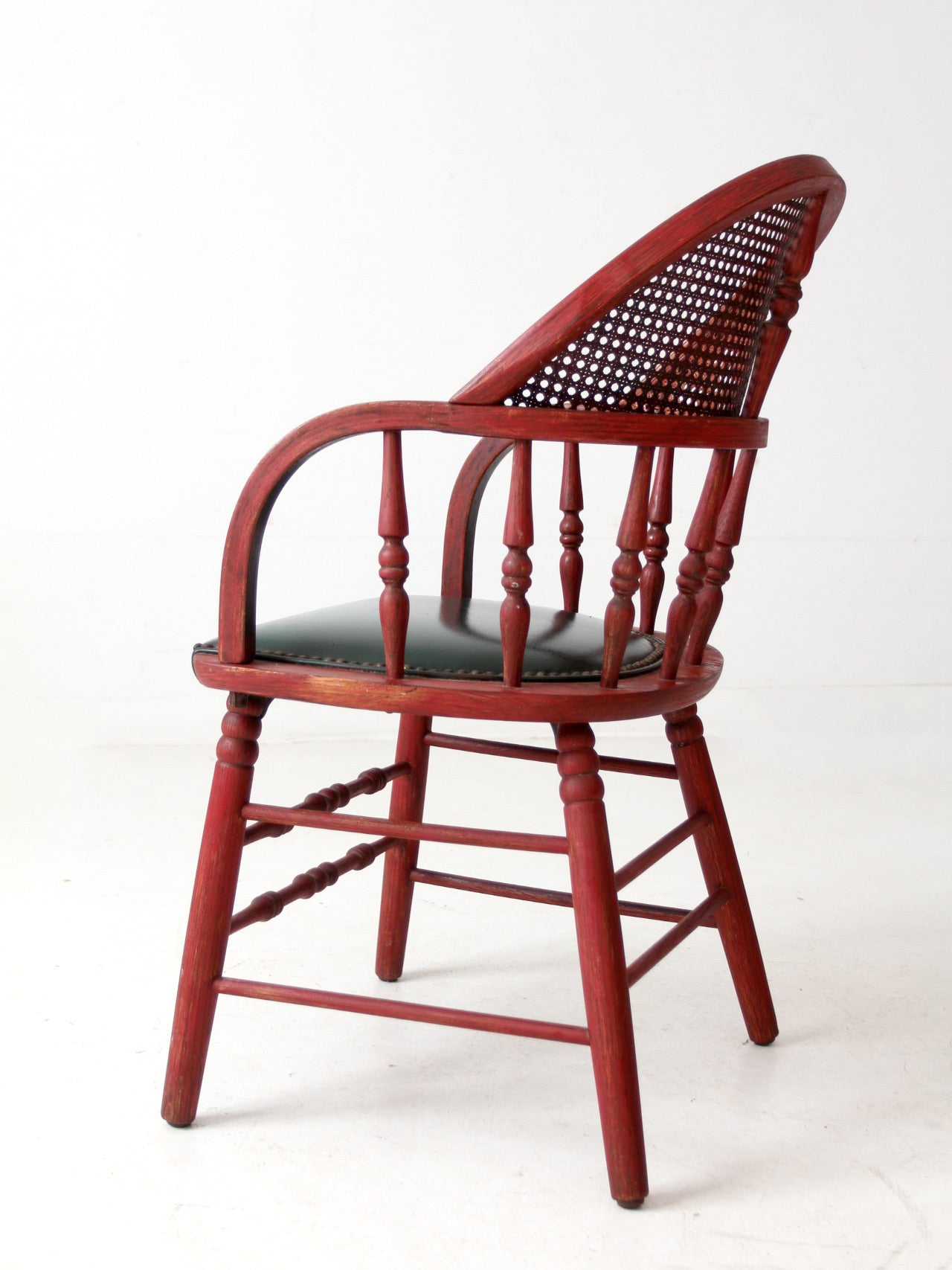 antique red Windsor cane back arm chair with upholstered seat