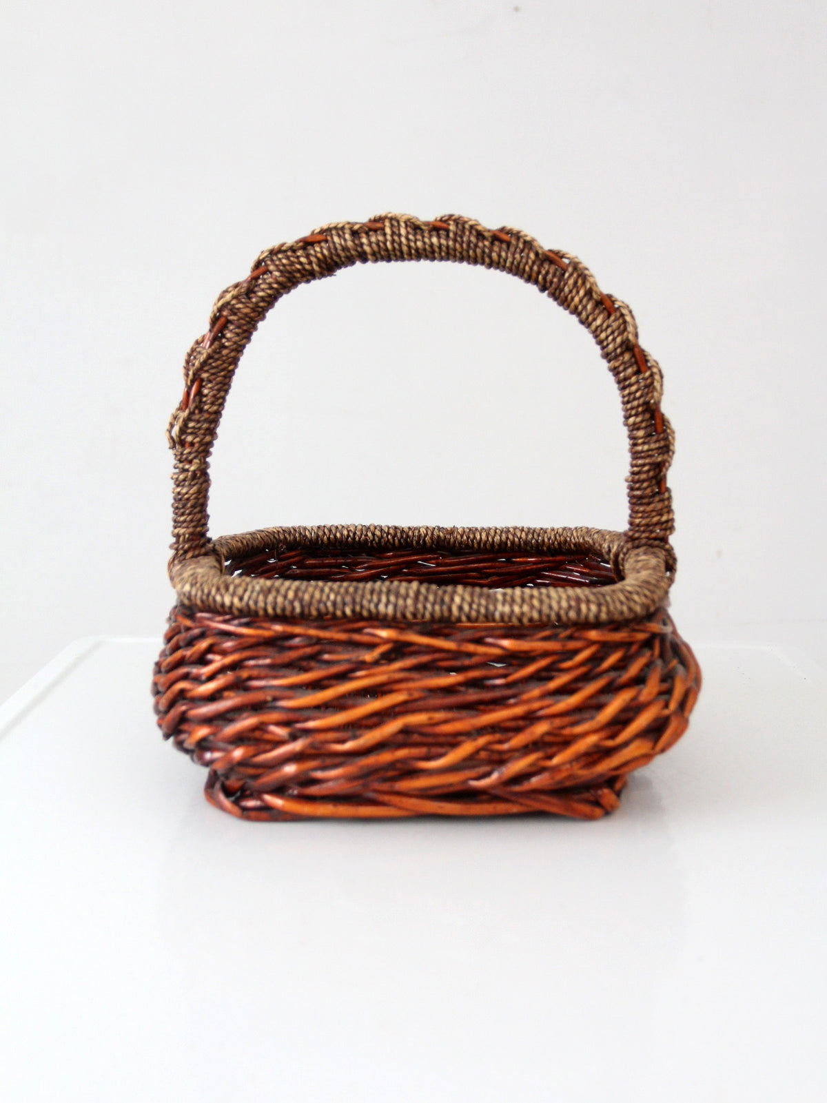 vintage woven willow basket with wrapped arched handle